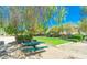 Neighborhood park featuring picnic tables, a grill, green grass and mature landscaping to be enjoyed by area residents at 4977 Vacaville Ave, Las Vegas, NV 89139