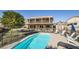 Backyard view that features a sparkling pool and spacious patio with seating at 525 Sunnys Halo Ct, Henderson, NV 89015