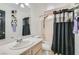 Cozy bathroom with single vanity and shower/tub combination at 525 Sunnys Halo Ct, Henderson, NV 89015