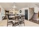 Open-concept dining area features tile flooring and connects to living area with stone fireplace at 525 Sunnys Halo Ct, Henderson, NV 89015