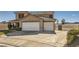 Spacious two-story home with a three-car garage and well-maintained landscaping at 525 Sunnys Halo Ct, Henderson, NV 89015