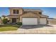 Lovely two-story home boasting a three-car garage, desert landscaping, and inviting curb appeal at 525 Sunnys Halo Ct, Henderson, NV 89015