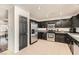 Functional kitchen featuring stainless steel appliances and dark cabinets at 525 Sunnys Halo Ct, Henderson, NV 89015