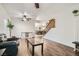 Open-concept living area featuring wood floors, natural light, and staircase view at 525 Sunnys Halo Ct, Henderson, NV 89015