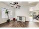 Bright room featuring wood floors, neutral paint, with view of dining area at 525 Sunnys Halo Ct, Henderson, NV 89015