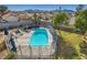 Aerial view of the pool, fence, patio and surrounding yard at 525 Sunnys Halo Ct, Henderson, NV 89015