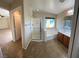 Bathroom featuring a walk-in shower, soaking tub, and double vanity, with tiled floors at 5361 Candlespice Way, Las Vegas, NV 89135