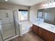 Bathroom featuring a walk-in shower, soaking tub, and double vanity at 5361 Candlespice Way, Las Vegas, NV 89135