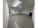 Spacious two-car garage with ample storage and a clean, painted floor at 5361 Candlespice Way, Las Vegas, NV 89135