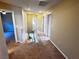 Second-floor hallway with carpeting, multiple doors, and natural light at 5361 Candlespice Way, Las Vegas, NV 89135