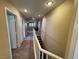 Second-story hallway featuring carpeting, neutral wall color, and access to multiple rooms at 5361 Candlespice Way, Las Vegas, NV 89135
