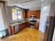 Well-equipped kitchen with stainless steel appliances, granite countertops, and travertine tile flooring at 5361 Candlespice Way, Las Vegas, NV 89135