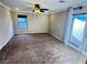 Living room featuring neutral carpet, ceiling fan, and French doors at 5361 Candlespice Way, Las Vegas, NV 89135