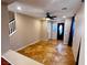 Bright living room with tile flooring, ceiling fan, staircase, and clear view of the front door at 5361 Candlespice Way, Las Vegas, NV 89135