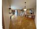 Bright living space with stairs, kitchen with stainless steel appliances, and open layout perfect for entertaining at 5361 Candlespice Way, Las Vegas, NV 89135