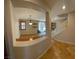 Open living space with archway views of the dining area, kitchen, staircase, and lots of natural light at 5361 Candlespice Way, Las Vegas, NV 89135