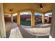 Covered patio featuring textured concrete and picturesque views of the backyard landscaping at 5361 Candlespice Way, Las Vegas, NV 89135