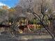 Playground surrounded by trees and metal fencing in community at 5361 Candlespice Way, Las Vegas, NV 89135