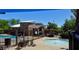 Community spa pool surrounded by lounge chairs, community seating, and shade in a luxurious setting at 5361 Candlespice Way, Las Vegas, NV 89135