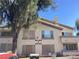 Multi-Gathering building with balconies and desert landscaping under a clear blue sky at 5710 E Tropicana Ave # 2003, Las Vegas, NV 89122