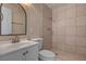 Bathroom features tiled shower, toilet, and vanity with modern fixtures at 6121 Edgewood Cir, Las Vegas, NV 89107