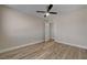 Bedroom with wood-look flooring, neutral walls, and a modern ceiling fan at 6121 Edgewood Cir, Las Vegas, NV 89107