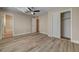 Bedroom with wood-look flooring, closet with sliding doors and ceiling fan at 6121 Edgewood Cir, Las Vegas, NV 89107