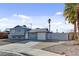 A two-story home with a garage, and minimalist landscaping at 6121 Edgewood Cir, Las Vegas, NV 89107