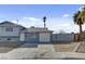 This is the exterior image of a two-story home with a garage and rock landscaping at 6121 Edgewood Cir, Las Vegas, NV 89107