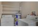 Functional laundry room with shelving for storage and washer/dryer hookups at 6121 Edgewood Cir, Las Vegas, NV 89107