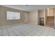 Open living room featuring tile floors, front door, and staircase at 6121 Edgewood Cir, Las Vegas, NV 89107