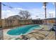 The backyard features an in-ground pool and rustic wooden fence at 6121 Edgewood Cir, Las Vegas, NV 89107