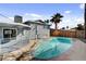 A spacious backyard featuring a refreshing in-ground pool and covered patio at 6121 Edgewood Cir, Las Vegas, NV 89107