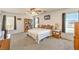 Bedroom featuring a ceiling fan, a comfortable bed, and windows that bring in natural light at 6472 Chebec St, North Las Vegas, NV 89084