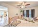 Bedroom with ceiling fan and natural light, featuring two twin beds and view to Kitchen at 6472 Chebec St, North Las Vegas, NV 89084