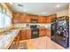 Spacious kitchen features tile floors, granite countertops, and stainless-steel appliances at 6472 Chebec St, North Las Vegas, NV 89084
