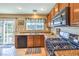 Bright kitchen with granite counters, gas range, and sliding door access to the backyard at 6472 Chebec St, North Las Vegas, NV 89084