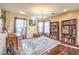 Bright living room featuring dark wood floors and built in bookshelves at 6472 Chebec St, North Las Vegas, NV 89084