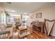 Comfortable living room features hardwood floors, a piano and natural light at 6472 Chebec St, North Las Vegas, NV 89084