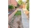 Cozy backyard with stone landscaping, pavers, and vibrant plants at 7317 Caballo Range Ave, Las Vegas, NV 89179