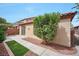 Home exterior featuring a patio, mature shrubbery, and a low-maintenance yard at 7317 Caballo Range Ave, Las Vegas, NV 89179