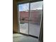 View of the backyard through a sliding glass door at 7317 Caballo Range Ave, Las Vegas, NV 89179