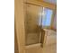 Clean bathroom featuring a shower with glass door and separate tub at 7317 Caballo Range Ave, Las Vegas, NV 89179