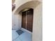 Inviting home entrance featuring double doors with an arched entryway at 7317 Caballo Range Ave, Las Vegas, NV 89179