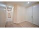 Inviting hallway with tiled floor at entry and carpeted path into the home at 7317 Caballo Range Ave, Las Vegas, NV 89179