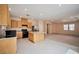 Well-lit kitchen featuring stainless steel appliances and an island at 7317 Caballo Range Ave, Las Vegas, NV 89179