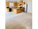 Bright kitchen featuring wooden cabinets, black appliances, and a center island at 7317 Caballo Range Ave, Las Vegas, NV 89179