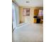Bright kitchen area with wooden cabinets and sliding glass door to the backyard at 7317 Caballo Range Ave, Las Vegas, NV 89179