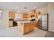 Bright kitchen featuring stainless steel appliances and an island at 7317 Caballo Range Ave, Las Vegas, NV 89179