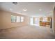 Spacious living room with carpet flooring and plenty of natural light at 7317 Caballo Range Ave, Las Vegas, NV 89179